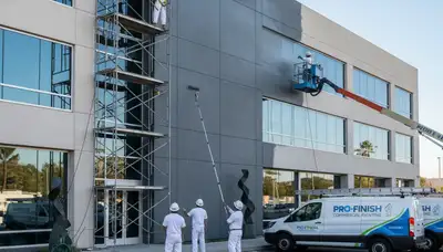 Commercial painters in Savannah, GA applying durable paint to local business exterior