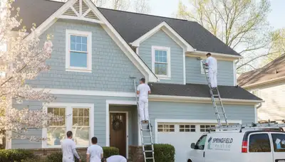 House painters in Savannah, GA painting a home exterior for a professional residential finish